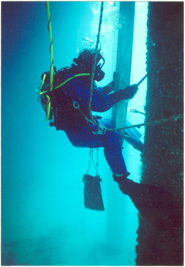 Diver welding on a new anode